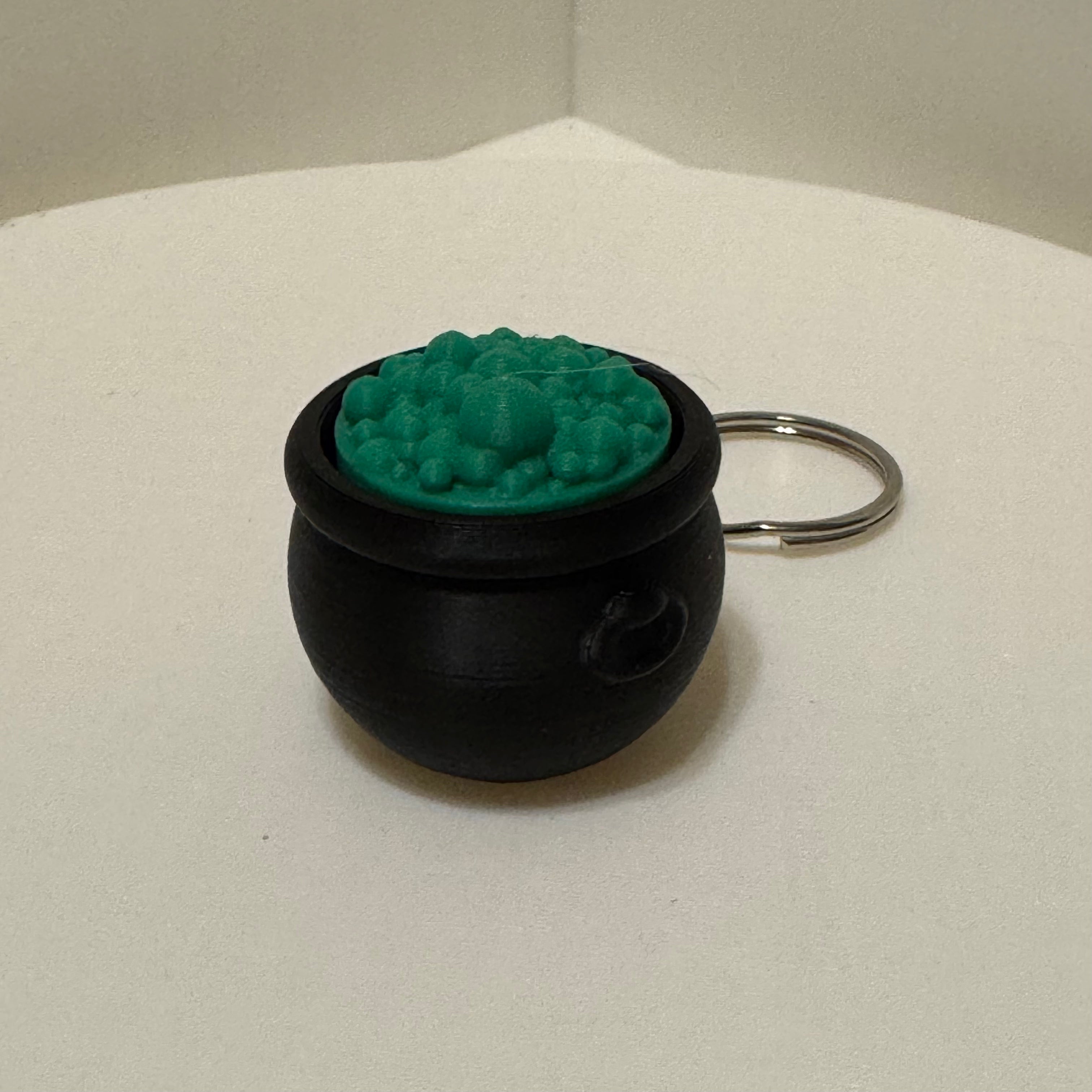 Bubbling cauldron keychain clicker